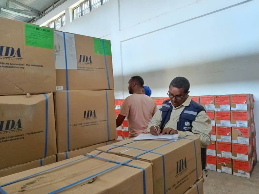 Mr Yewulsow Dellelle verifying that each item of his checklist has been delivered and discussing the supply dispatch plan with RHB warehouse personnel. ©WHO Bahir Dar    