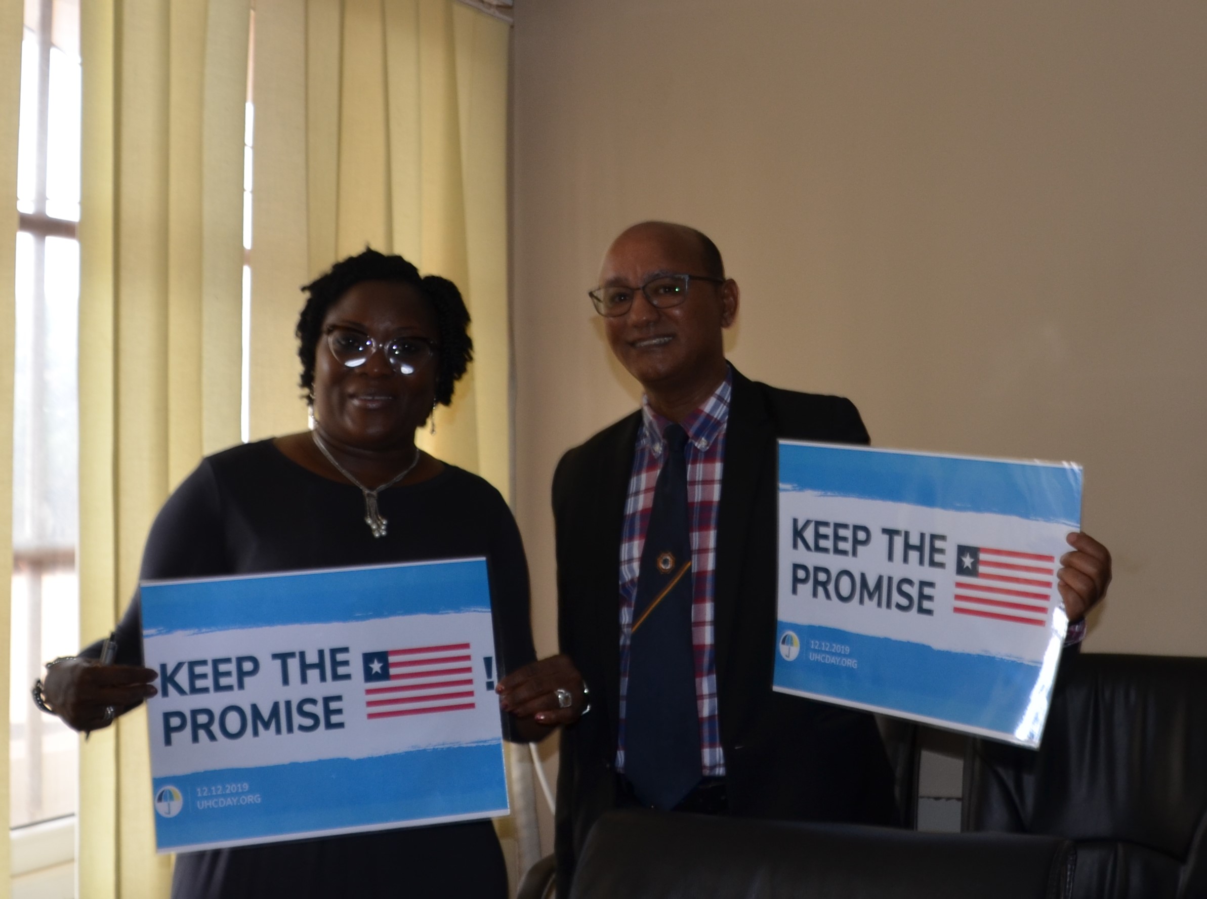 Dr.Zbelo, WR ai Liberia Country Office with Deputy Health Minister Ms. Norwu Howard during the commemoration of UHC Day in Monrovia