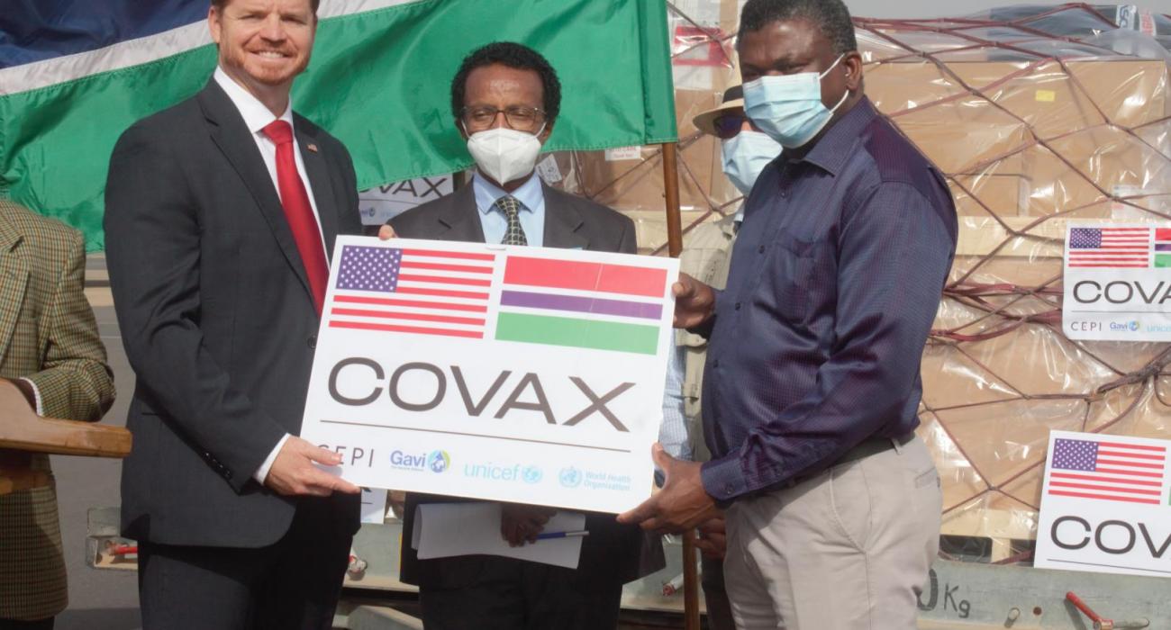 The Deputy Chief of Mission at the United States Embassy in the Gambia, Mr Jason Willis official handing over the vaccines to the Hon. Minister for Health, Dr. Ahmadou Lamin Samateh