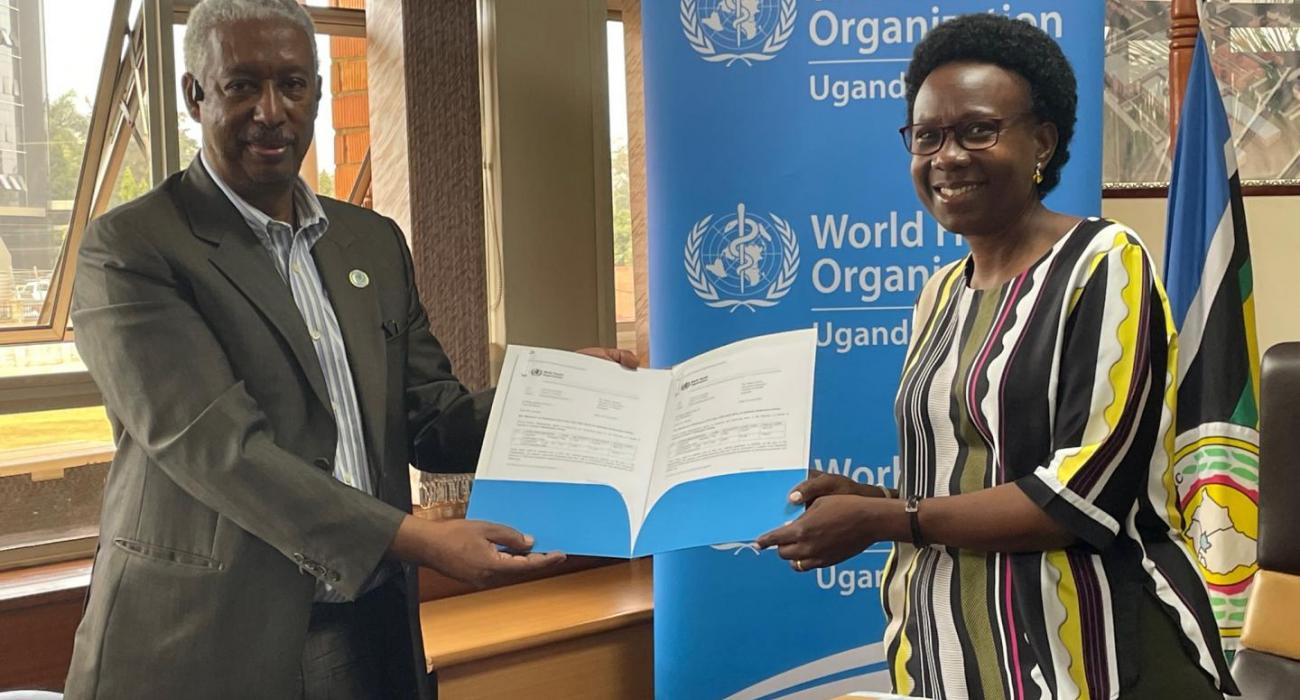 WHO Representative to Uganda, Dr Yonas Tegegn Woldemariam handing over 2400 monkeypox tests to the Minister of Health Hon Dr Jane Ruth Aceng Acero.