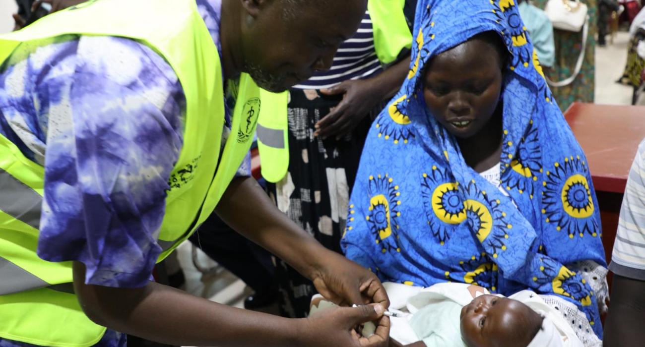 A health worker administering measles vaccine at Al-Sabah Children's Hospital in Juba 