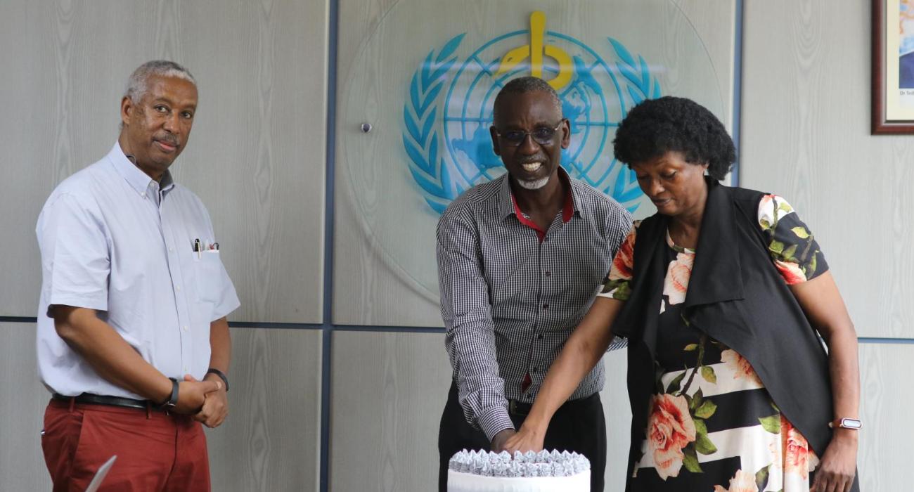 Dr. Yonas Tegegn, WHO Representative to Uganda (far left) at the service end of Mrs. Elizabeth Malinga, and Mr. Collins Mwesigye, WHO Climate Change Officer.
