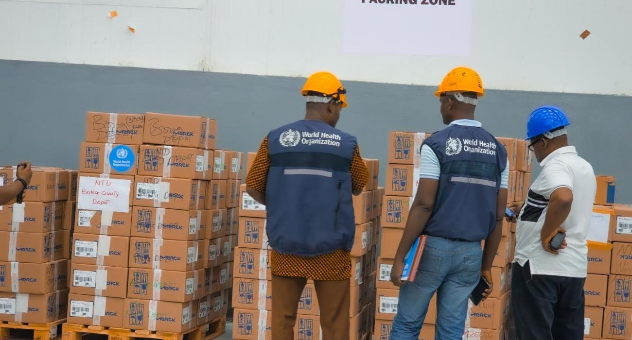 WHO Liberia staff inspecting consignment together with Central Medical Stores staff