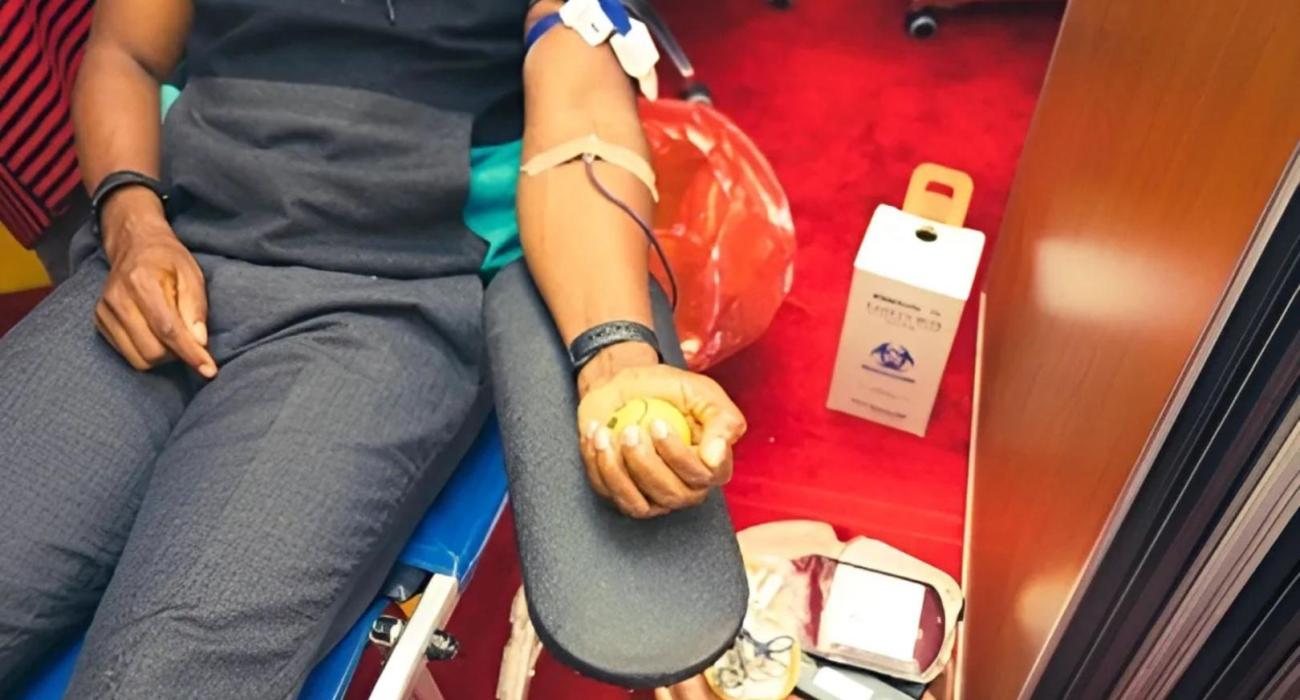 A donor donating blood during the UN blood drive to mark World Blood Donor Day
