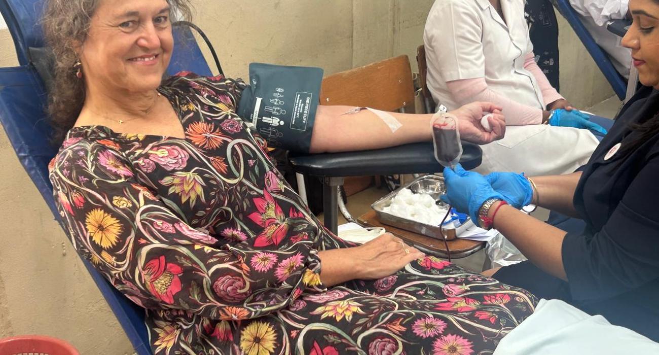 Dr Anne Ancia, the WHO Representative donating blood and calling upon students to commit as lifetime donor