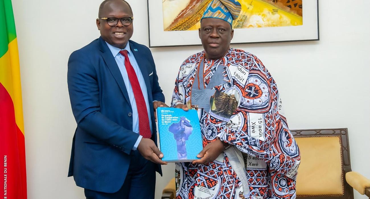 Dr. Kouamé Jean Konan, WHO Representative in Benin, presenting the WHO Benin Country Cooperation Strategy 2023–2027 to His Excellency Louis Gbèhounou Vlavonou, President of the National Assembly.