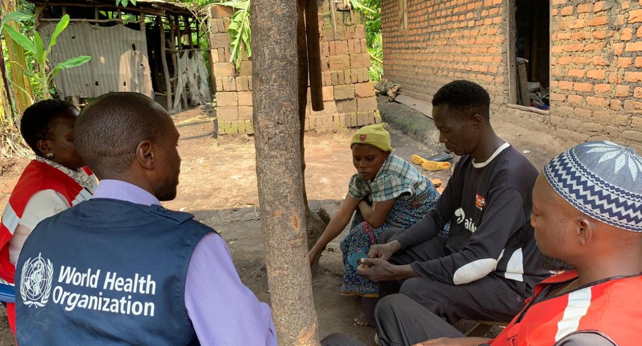 A WHO staff member conducting a community engagement session