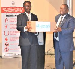 WHO Representative, Dr Charles Sagoe-Moses handing over COVID-19 medical supplies to the Honorable Minister of Health and Social Services, Dr. Kalumbi Shangula 