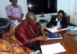  Dr Gakuruh and Dr Jambai signing a Memorandum.