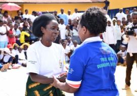 Rwanda Biomedical Centre Director General, Dr. Jeanine Condo congratulating a former TB patient after testimony