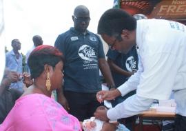 WR Dr. Sagoe-Moses immunizing a child