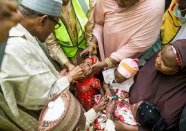 President Muhammadu Buhari vaccinating a child with OPV during the flag off of the Katsina State September 2015 SIPDs at his residence in Daura town on 5th September 2015
