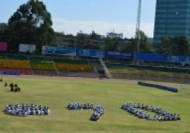 UN@70 in a human stamp drawn by students.