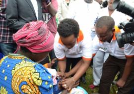 The Minister of Gender and Family Promotion, Dr Diane Gashumba, vaccinating against pneumonia at the launching of MCH week