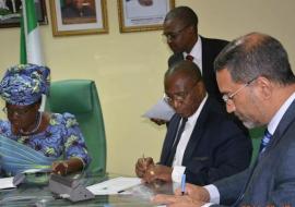 The Minister (left), AfDB Country Director and WR signing the MOU