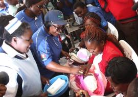 Zambia’s First Lady, Mrs Esther Lungu administers oral polio vaccine to a baby at the AVW regional launch in Lusaka