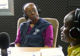 Zainab Akiwumi in the radio studio of Radio Maria talking about the need to suspend cultural and traditional practices in times of Ebola, Sierra Leone. WHO/S. Saporito