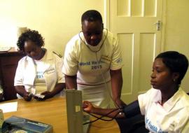 One of the participants getting her blood pressure checked in one of the screening booths