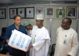 Dr. Rui Gama Vaz handing over the training DVDs to Dr. Ado Mohammed