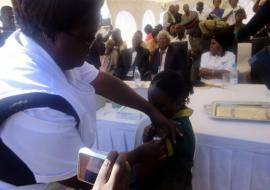 A grade four pupil getting vaccinated