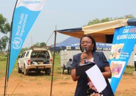 Deputy Director of Health Services-Clinical Dr Velephi Okello delivering remarks of behalf of the Minister during the event.