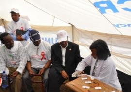 Dr Kesetebirhan Admassu, Minister of Health, being tested for HIV with Dr Warren Naamara, UNAIDS Country Director and Dr Pierre M'Pele-Kilebou, WHO Representative to Ethiopia.