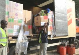 A team of casual workers offloading emergency medical supplies at State Ministry of Health warehouse