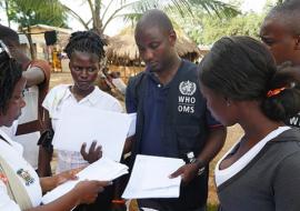 Ebola contact tracing team at work in the quarantined village, Bombali district, Sierra Leone.