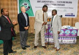 Dr Eugene Nyarko, WR Malawi shaking hands with the Minister of Health, Honorable Dr Peter Kumpalume, MP