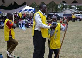 Polio Champion David Otieno speaks during the launch. Migori County health director Dr Joel Gondi is beside him