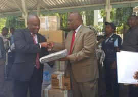 The WHO Representative, Dr. Rufaro Chatora handing over an ECG machine to the Chief Medical Office