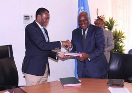 The WHO Representative, Dr. Rufaro Chatora and the Permanent Secretary, Dr. Donan Mmbando exchanging the certificates of transfer.