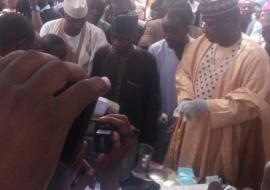 Sokoto Commissioner for Health (1st right) preparing to vaccinate a child at the flag-off