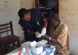 A laboratory technician at WHO collecting blood specimens for testing Lymphatic Filariasis