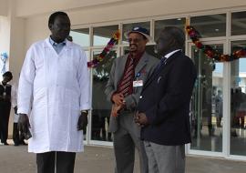 Hon Minister of Health Dr Riek Gai Kok, Dr Abdi Mohamed and Dr Makur Kariom, Undersecretary Ministry of Health at the Rumbek Maternity Hospital entrance