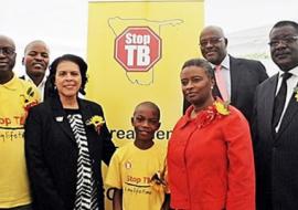WHO Representative, Dr Magda Robalo, US Ambassador Ms Wanda Nesbit, Khomas Regional Governor, Mr Samuel Nuuyoma, Permanent Secretary, Ministry of Health and Social Services Mr Kahuure, Khomas Regional Director Mr Taapopi at the World TB commemoration pose with 12 years old TB patient, Petrus Dumeni who was diagnosed and successfully completed TB treatment