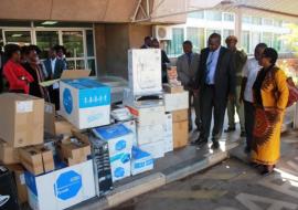 Dr. Mary Katepa Bwalya, OIC at WHO handing over the medical supplies to the Minister of Health, Dr. Chitalu Chilufya (left) in the presence of Dr. Victor Mukonka, Director at the National Public Health Institute