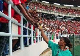 Disinfecting spectators’ hands with hand sanitizing gel at the Africa Cup of Nations, Equatorial Guinea, 2015 WHO/Nicolas Isla