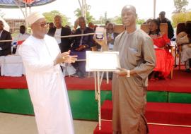 Prof. JM Dangou presenting award to Hon. Minister for Finance & Economic Affairs