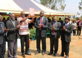 The Minister of Health, Honorable Atupele Muluzi waves high the newly launched National Alcohol Policy for Malawi The Minister of Health, Honorable Atupele Muluzi waves high the newly launched National Alcohol Policy for Malawi