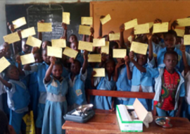 Primary school pupils of Eleyin in Isanlu, Isin LGA of Kwara state displaying their YF vaccination card