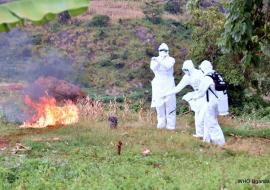 The burial team burning the bedding and and clothes of the dead MVD confirmed case in Kween district