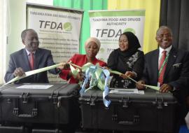 Official launch of the minilab kits. From Left to right: Dr. Matthieu Kamwa, WHO Representative a.i,; Honourable Ummy Ally Mwalimu, Minister of Health, Community Development, Gender, Elderly and Children;  Mrs Zaina Thabit, Representative of the Ministerial Advisory Board; Mr Hiiti Sillo, Director General, Tanzania, Food and Drug Authority (TFDA) and Mr Yohana Hebroni, Acting Director, laboratory services, TFDA