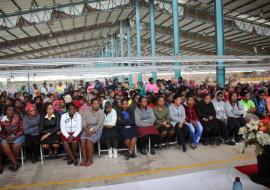 Over 300 textile workers listening to presentations during the World Mental Health Day commemoration at the factory.