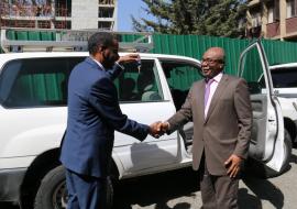 L to R Minister holding key in hands after receiving the key from WHO Representative to Ethiopia 