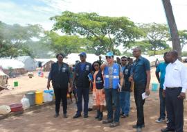 The WHO Representative, Dr. Nathan Bakyaita  (second from left), accompanied by WHO National Surveillance Officers and the Disease Prevention and Control Officer on a conducted tour of Mantampala Refugee Camp