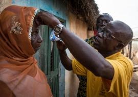 Opthalmic Nurse examining a woman in Yendi