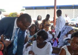 Dr Kaluwa interacts with a nursing mother at a Postnatal Clinic