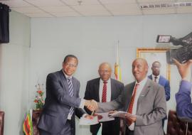 Honorable Minister of Finance and Economic Development Prof. Mthuli Ncube and WR Dr Gasasira shaking hands after signing for the grant