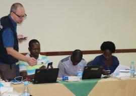 Dr. Boris Pavlin, WHO Epidemiologist  demonstrates the use of an EWARS mobile phone during the training
